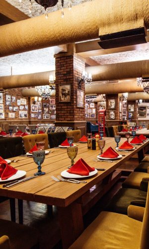 restaurant-hall-with-red-brick-walls-wooden-tables-pipes-ceiling (1) restaurant-hall-with-red-brick-walls-wooden-tables-pipes-ceiling (1)